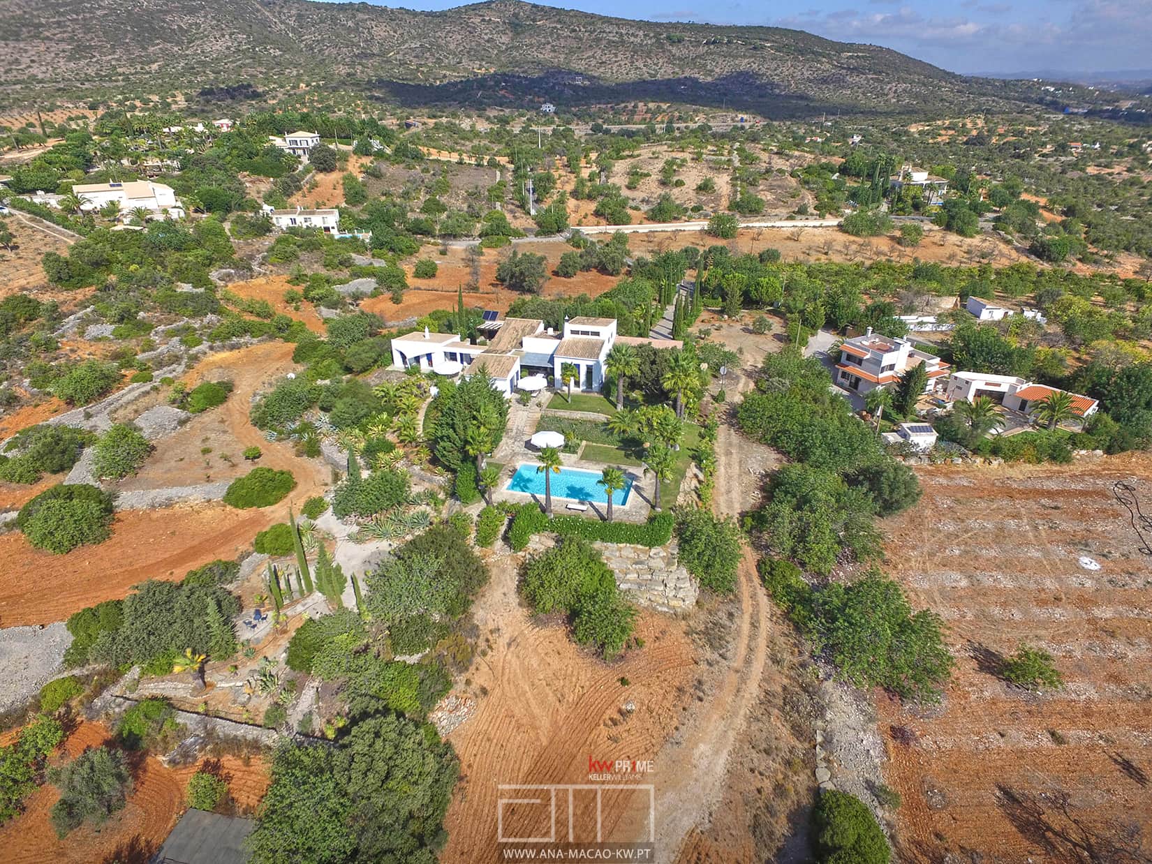 Aerial view of land and house