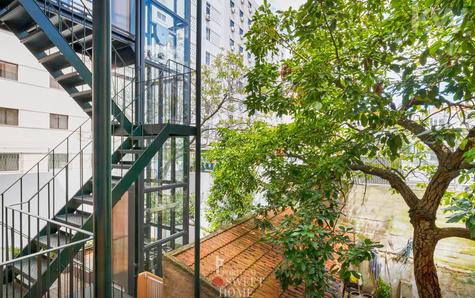 Balcony and stairs with elevator at the back