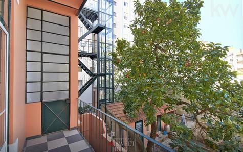 Balcony and stairs with elevator at the back