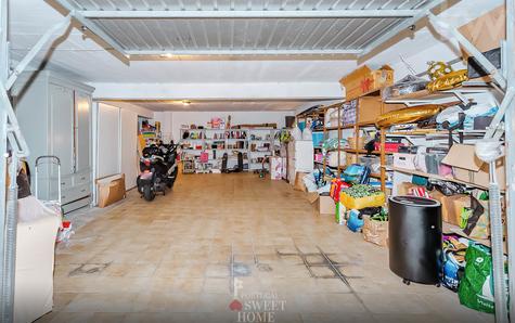 Large garage with space for 3 cars and storage