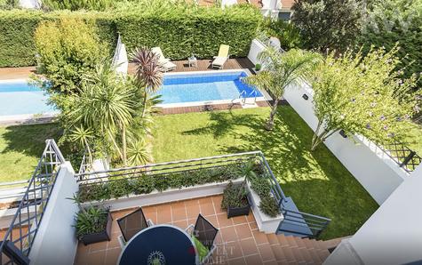 View of the garden and pool from the 2nd floor balcony