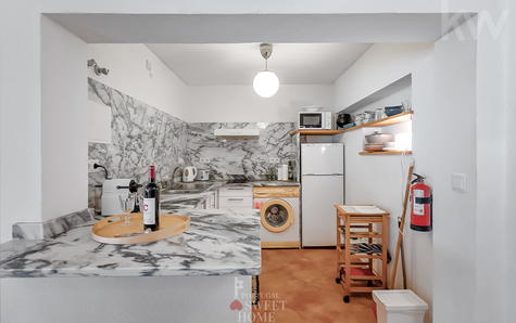 Cuisine (6,27 m²) ouverte sur le salon de l'appartement indépendant, entièrement équipée