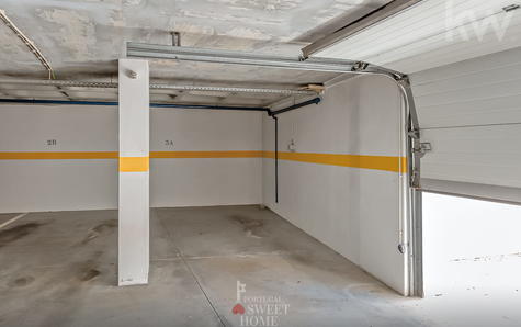 1 of 2 parking spaces in the building's garage