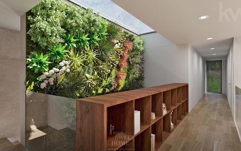 Second-floor hallway, interior garden, with natural lighting from the ceiling.