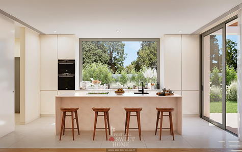 Cozinha aberta para a sala e vista para o jardim