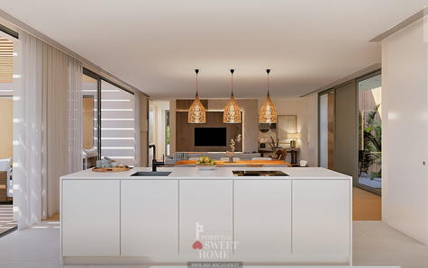 Cozinha aberta para a sala, lavandaria e vista para o jardim