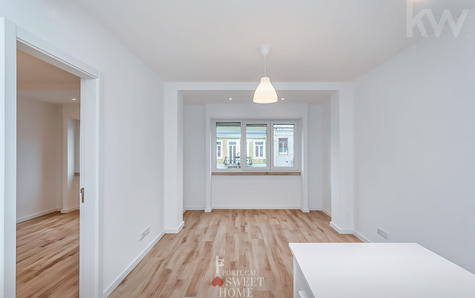 Vista da sala aberta para a cozinha