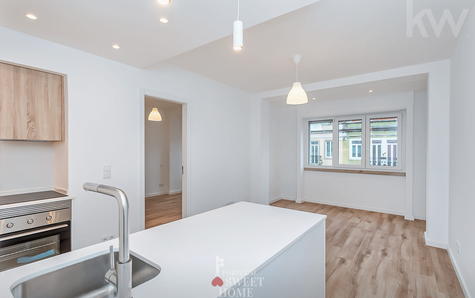 View from the open-plan living room to the kitchen.
