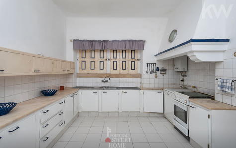 Cozinha com zona de lavandaria