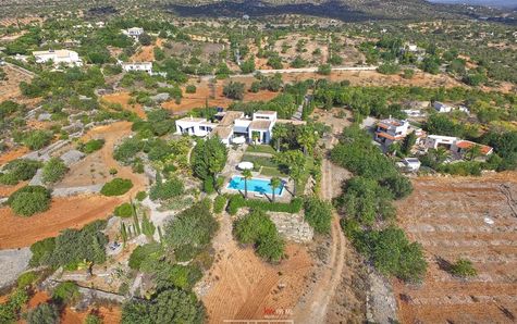 Aerial view of land and house
