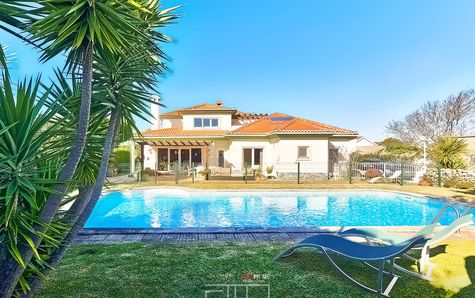 Exterior view of the house and pool